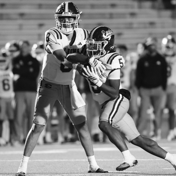 QB Chris Martinez hands the ball to Wenderius Jones in a game last year. Chris McGathey Photo
