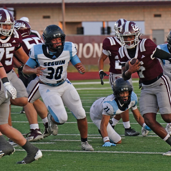 QB Elijah LeBlanc (7) breaks-off a big run in the Lions first touchdown drive. photosbylezley.com