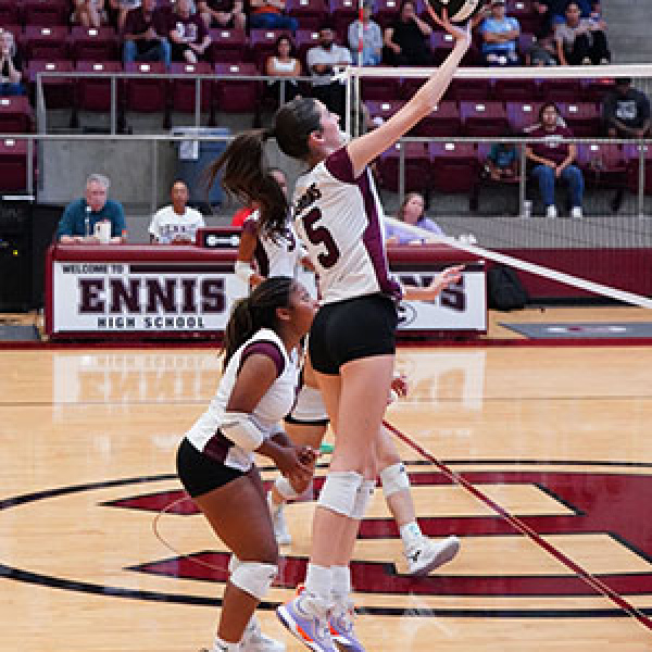 Taylor McManus (5) tips the ball at the net. photosbylezley.com
