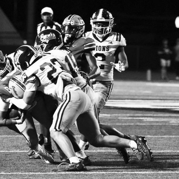 RJ Eddington (23) and Kendall Polk (15) make a tackle. photosbylezley.com
