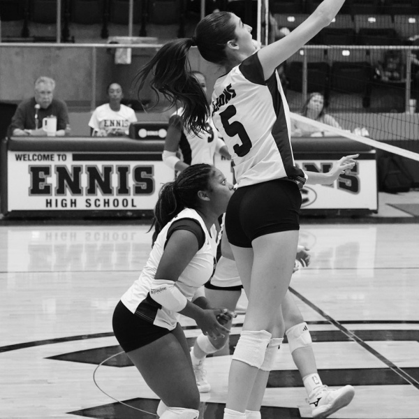 Taylor McManus (5) tips the ball at the net. photosbylezley.com