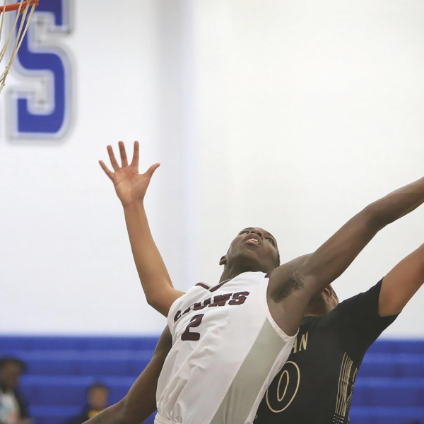 	Kaufman sinks free throws and Ennis, 75-69 in double OT 