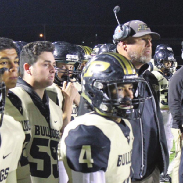 Head Coach Don Waddle and players on the sideline late in the 2019 season. Palmer has  produced winning records in 4-of-6 years under Waddle, including two district championships. Staff Photo/Mark Warde