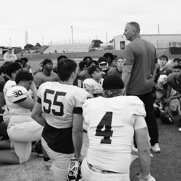 Head Coach Don Drake addresses players after the Spring Game, which was comprised only of incoming sophomores, juniors and new seniors. photosbylezley.com