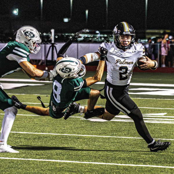 Brandon Lee Photography QB Sutton Maddox (2) stiffarms Chandler Bridges (8) of Scurry-Rosser.