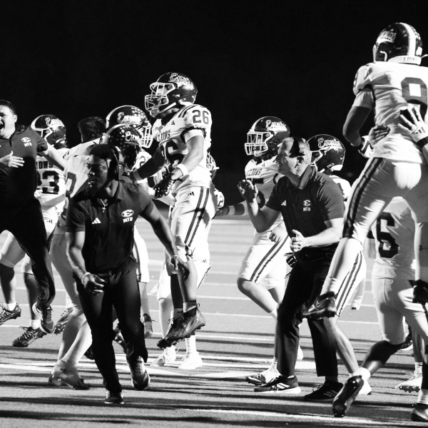 photosbylezley.com Ennis sideline erupts when the defense stopped Joshua on the last play at the one-yard line. HC Don Drake (right) was one of the few not captured airborn.