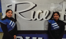 Julissa Duran and Jasmin Martinez are drum majors at Rice H.S. Anthony Gaddy Photo