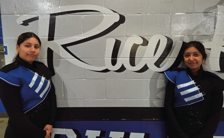 Julissa Duran and Jasmin Martinez are drum majors at Rice H.S. Anthony Gaddy Photo