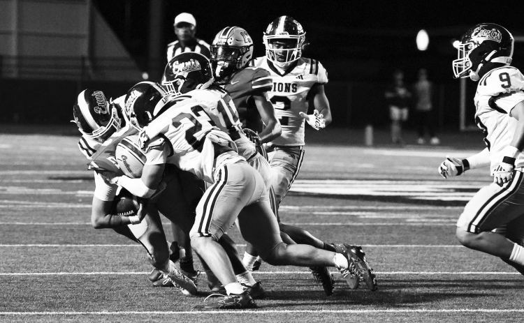 RJ Eddington (23) and Kendall Polk (15) make a tackle. photosbylezley.com