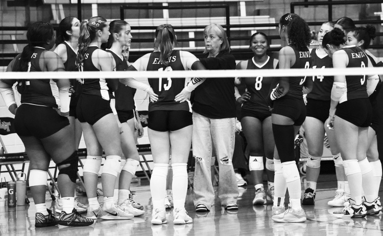 HC Kelly Henderson is the center of a team huddle at Lancaster photosbylezley.com