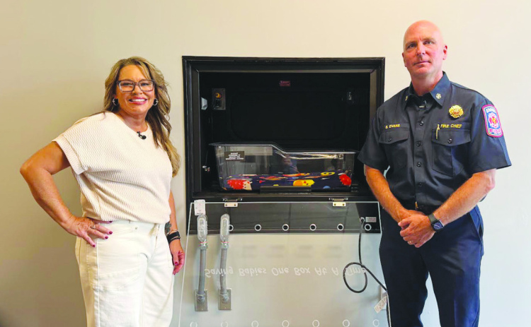 Courtesy Photos/City of Ennis Safe Haven Baby Boxes Founder and CEO Monica Kelsey and Ennis Fire Chief Bill Evans.