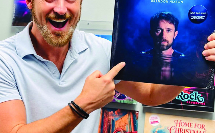 Courtesy Photo Brandon Hixson with his award-winning album, “Into the Blue.”
