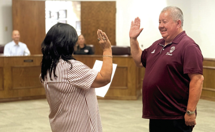 Tommy Aguilar (right) sworn in on July 21 by Virginia Lopez. Courtesy Photo/EISD Communications