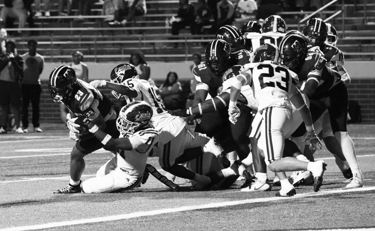 photosbylezley.com Goal Line Stand – Damion Baizar (11), Kendall Polk (15) and RJ Eddington (23) stuff J’Uan Harrison (23) on a fourth and goal.