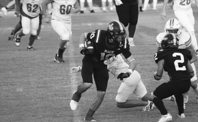 Brody Lawhon (10) heads upfield thanks to a Hugo Hernandez (2) block. Courtesy Photo/Rice Yearbook Staff