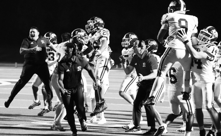 photosbylezley.com Ennis sideline erupts when the defense stopped Joshua on the last play at the one-yard line. HC Don Drake (right) was one of the few not captured airborn.