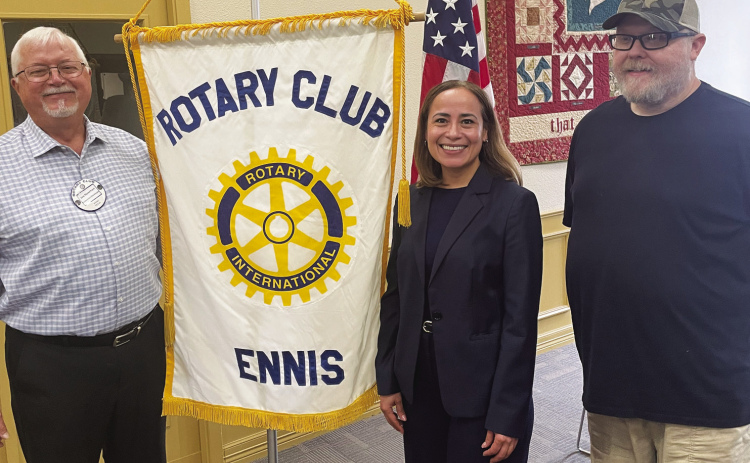 Staff Photo/Mark Warde Rotarians Joe Newman (left) and new president Greg Brown flank Ennis Economic Development Director Miriam Castillo.